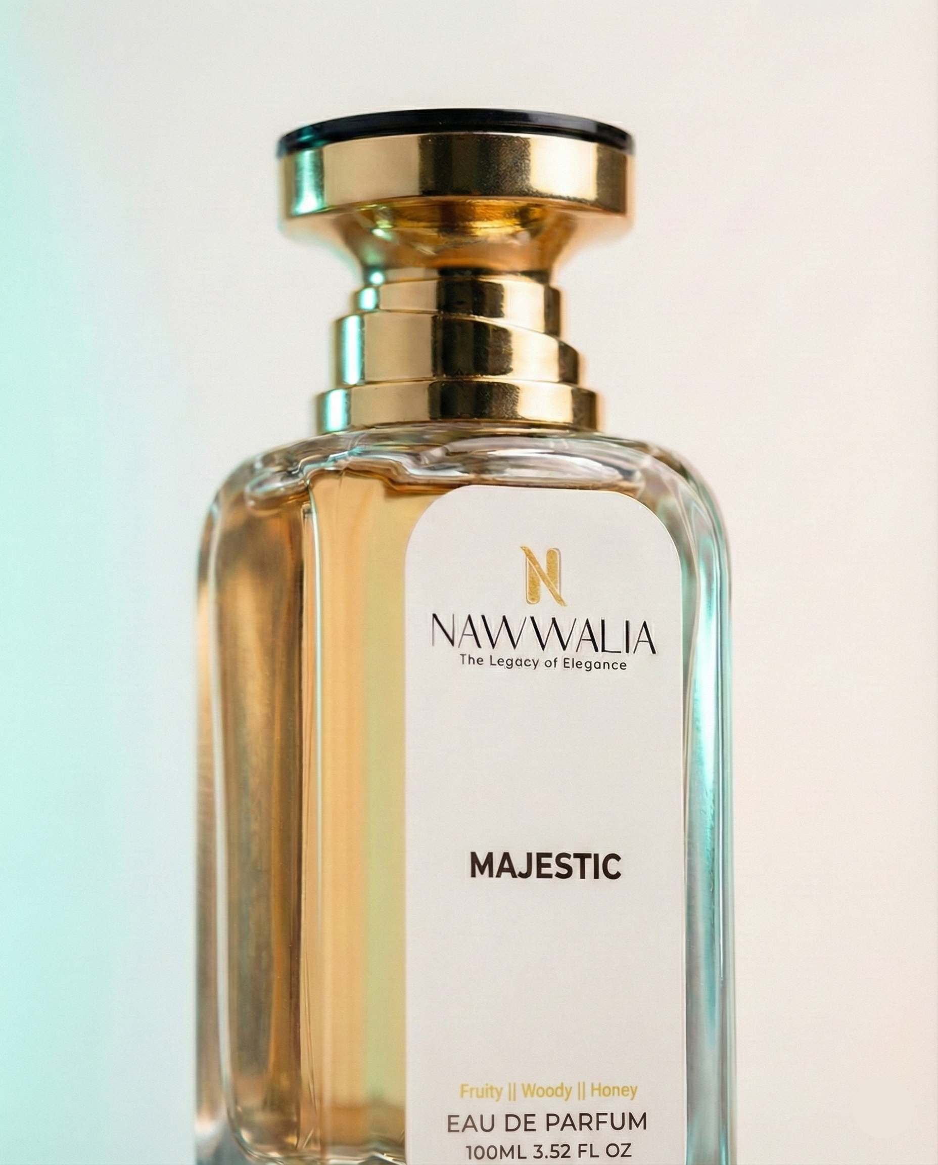 Perfume bottle labeled 'Majestic' by Nawwalia on a gradient background